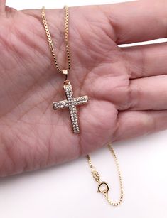 "Cubic Zirconia Cross Necklace Beautiful Cross 18k gold plating with zirconia encrusted. The cross measures 1.2 x 0.75 inch or 3 x 1.9 cm box 1mm chain. Details: 18K Gold Plated Pendant and chain Spring-ring clasp for closure Length 17.5\" inches or 45 cm It looks great alone or layering with other necklaces. It is carefully shipped in a beautiful organza pouch, bubble wrapped and well protected. A lot of my jewelry is made with silver plated and gold plated solid brass or any other metal. It wi Gold Jewelry With Diamond Accents And Cross Shape, Crucifix Necklace With Vvs Clarity As Gift, Gift Crucifix Necklace Vvs Clarity, Gift Crucifix Necklace With Vvs Clarity, Gold Diamond Crucifix Jewelry, Yellow Gold Cubic Zirconia Crucifix Jewelry, Yellow Gold Crucifix Jewelry With Cubic Zirconia, Gift Cross Necklace With Diamond Accents In Cubic Zirconia, Gold Crucifix Jewelry With Diamond Accents