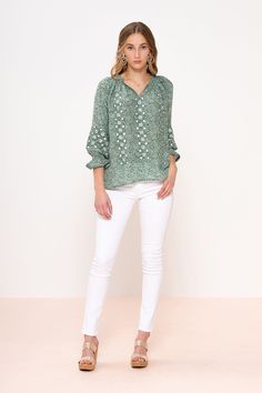 Transport yourself to the busy streets of Madrid in this très chic embroidered blouse. Show off a fun billowy sleeve, cinched with a geometric embroidered pattern while sightseeing around the city. Open V neckline blouse with contrast embroidered panels running down the front and circling the sleeve. Cinching at wrist finished with a petit fluted sleeve. Hook and eye closure at neckline. Generous fit. WE RECOMMEND SIZING DOWN. Elegant Spring Embroidered Top With Geometric Embroidery, Casual Embroidered Puff Sleeve Blouse, Casual Blouse With Geometric Embroidery For Spring, Summer Blouse With Bell Blouson Sleeves, Summer Blouse With Bell And Blouson Sleeves, Summer Blouse With Bell Sleeves, Trendy Spring Blouse With Elastic Sleeves, Spring Long Sleeve Peasant Top With Elastic Sleeves, Trendy Blouse With Elastic Sleeves For Spring