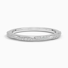 a white gold wedding band with pave set diamonds