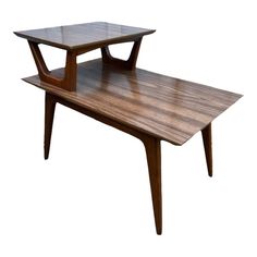 a wooden table sitting on top of a white background