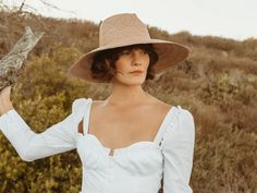 Broad-brimmed fedora with an innovative braid-like woven pattern. 10cm brim Hand Woven Panama Hat from Paja Toquilla straw Each hat is unique and reflects the natural beauty & variation of the handicraft process XS (55cm), Small, Medium (56-57cm), Large (58-59cm), XL (60cm) Natural Color Country Style Straw Hat For Spring, Natural Country Style Straw Hat For Spring, Country Style Natural Straw Hat For Spring, Eco-friendly Toquilla Straw Hat, Eco-friendly Straw Hat For Spring, Chic Fitted Natural Straw Hat, Natural Short Brim Boater Hat For Picnics, Spring Braided Toquilla Straw Hat, Braided Natural Spring Hat