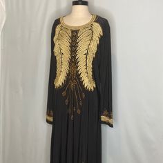 Lucky Collection Black Gold Embroidery Leaves Studs Long Sleeves Long Maxi Dress Size 56 Jersey Knit Size 56 Fit Approx Medium/Large Measurements" Bust :21 Length 54 Sleeves 24 New With Tag Dress Gold Embroidery Down The Bust, Neck, Side And Arms. Pull Over Dress With No Zipper Not Lined Very Beautiful Dress, You Will Not See Yourself Coming Or Going In This Amazing Free Loose Style Dress Please Note That The Dress Is By Lucky, Not Lucky Brand. Thank You For Choosing To Shop My Closet! Black Floral Embroidered Dress For Eid, Black Long Dress With Intricate Embroidery, Long Black Dress With Intricate Embroidery, Embroidered Black Dress For Eid, Black Long Sleeve Dresses For Eid, Festive Embellished Black Maxi Dress, Festive Black Embellished Maxi Dress, Festive Black Embellished Embroidered Dress, Fitted Embroidered Black Abaya