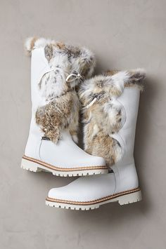 You'll revel in winter weather when you get to wear the Sira boots, handcrafted from leather and soft rabbit fur in Northern Italy. Built to keep you cozy warm in temps as low as -4°F with their 100% wool footbeds and insulating lining, these snow-proof and water-resistant boots feature decorative leather lacing and an abundance of plush fur trim. Robust synthetic nonskid outsoles provide traction on ice and snow. Luxury Wool Boots For Winter, Warm Winter Leather Boots, Faux Fur Snow Boots, Luxury Winter Boots With Leather Sole, Luxury Winter Boots With Closed Toe, Luxury Gray Boots For Fall, Luxury Waterproof Winter Boots For Women, Luxury Women's Winter Wedge Boots, Luxury Winter Waterproof Boots