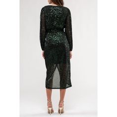 Introducing the August Sky Women's Sequin Faux Wrap Midi Dress, your ultimate party companion for ringing in the New Year or dazzling at any formal event. This dress features a captivating V-neckline with a hidden snap closure, adding an element of allure to your look. With elastic around the waistline, it guarantees a comfortable and flattering fit, while the long sheer puff sleeves, adorned with elastic openings, exude a touch of glamour. A faux tie around the waistline adds a hint of playfulness. Lined to perfection to prevent any sheerness, this dress showcases an alluring tulip hemline. Embrace the spotlight with this shimmering sequin ensemble that's bound to steal the show wherever you go. Ringing In The New Year, Wrap Midi Dress, Sheer Sleeves, Puff Sleeves, Formal Event, Snap Closure, Puff Sleeve, Dark Green, Sleeve Styles