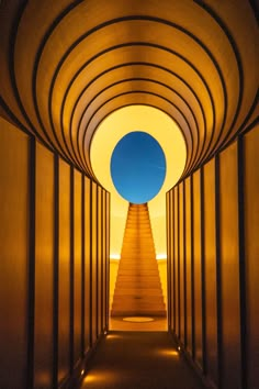 a long tunnel with stairs leading up to the sky