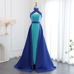 This stunning dreamy blue evening dress is a must-have for any formal occasion. The criss cross halter top adds a touch of elegance, while the overskirt creates a dramatic silhouette. Perfect for weddings and parties, this dress will make you stand out in any crowd. window.adminAccountId=244214477; Blue Bridesmaid Dress With Sweep Train For Prom, Blue Fitted Bodice Prom Dress, Blue Bridesmaid Dress With Fitted Bodice For Prom, Blue Satin Evening Dress With Sweep Train, Blue Sleeveless Bridesmaid Dress For Prom Season, Blue Sleeveless Bridesmaid Dress For Prom, Blue Sleeveless Bridesmaid Dress For Evening, Blue Bridesmaid Dress For Prom Season Evening, Blue Satin Halter Evening Dress