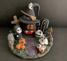 there is a halloween cake with many items on it