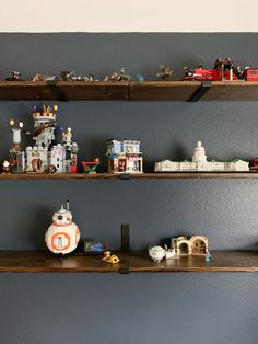 some shelves with toy cars and toys on them