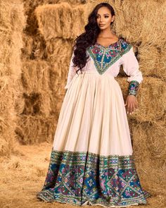 This elegant Habesha dress features a rich, dark blue hue with beautifully crafted patterns that capture the essence of tradition and modern style. The intricate detailing adds sophistication, making it perfect for special occasions or cultural celebrations. Material Cotton Menen Thread Estimated delivery : 4 weeks to 6 weeks Contact WhatsApp +1(304)-306-2784Email: contact@ethiopian.store Holiday Wedding Dress, Habesha Women, Eritrean Wedding, Habesha Wedding, Gold Beaded Dress, Ethiopian Clothing, Cultural Dress, Ethiopian Traditional Dress, Habesha Dress