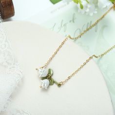 Lily of the Valley Necklace is designed according to little bell-shaped flowers. This exquisite necklace is a piece of fine jewelry made with freshwater pearls and very popular on Selenichast online shop and on Instagram as well. Pearl Jewelry Gift, Mother Of Pearl Jewelry, Jewelry Gift Ideas, Exclusive Gift, Lily Of The Valley, Gold Material, The Valley, Pearl Jewelry, Design Crafts