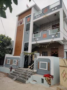 an apartment building with stairs leading up to it