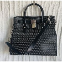 Michael Michael Kors Black Studded Leather Ns Hamilton Satchel Satchel Is In Good Condition (Other Than Some Scuffs On The Hardware) And Comes From A Smoke Free And A Pet Free Home. Length 13 Inches Height 12.5 Inches Depth 6 Inches Baghdad Top Handles, A Shoulder Strap, A Magnetic Snap Closure, An Interior Zip Pocket And Interior Slip Pockets. Bag Has Silver Toned Studs And Hardware. Designer Silver Textured Leather Bag, Black Luxury Bags With Silver Accents, Luxury Black Bags With Silver Accents, Luxury Shoulder Bag With Silver Accents For Formal Occasions, Luxury Formal Shoulder Bag With Silver Accents, Chic Black Bags With Silver Accents, Luxury Leather Bag With Silver Accents, Evening Leather Shoulder Bag With Silver Accents, Leather Party Bag With Silver Accents