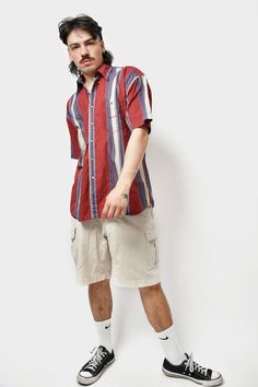 🚀Need to get your order super fast? Choose DHL Express shipping upgrade in your cart. It takes only 1-2 b. days to European Union countries and 2-5 b. days to USA, Canada and all other countries. Orders are ready to ship in 1 b. day. 🔥90s style striped cotton button up short sleeve shirt in red blue multi colour. Size - M. Model is 177 cm / 5ft 9.6" tall and usually wears size M. Very good condition. Only 1 available! All orders are shipped every day Worldwide from 🇪🇺EU. Safe registered stan Relaxed Fit Short Sleeve Cotton Shirt With Vertical Stripes, Red Short Sleeve Tops With Vertical Stripes, Cotton Shirt With Vertical Stripes For Summer, Summer Cotton Shirt With Vertical Stripes, Cotton Summer Shirt With Vertical Stripes, Casual Collared Short Sleeve Shirt With Vertical Stripes, Casual Short Sleeve Shirt With Vertical Stripes, Vertical Stripes Relaxed Fit Short Sleeve Shirt, Relaxed Fit Shirt With Vertical Stripes And Short Sleeves