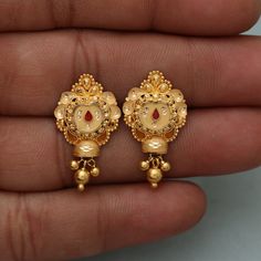 Discover the allure of Handmade Gold Jewelry at https://morvijewels.etsy.com/   Get a dazzling 25% off on all our 22k and 18k gold pieces. Don't miss out on this limited-time offer. Shop now and embrace the radiance of gold! Beautiful yellow gold earrings  Gold Purity- 22k yellow Gold Max Length - 2.6 cm approx Max Width - 1.5 cm approx Weight - 4.2 grams approx The earrings comes with normal push/backs but If you want real gold screw please let us know. Click here  https://morvijewels.etsy.com/    to get more discount and offers Happy to take wholesale bulk orders. 22k Gold Tikka With Intricate Design, 22k Gold Chandbali Jhumkas For Anniversary, Festive 22k Yellow Gold Bridal Earrings, Gold Plated Earrings With Intricate Design For Puja, Diwali 22k Gold Tikka With Intricate Design, Gold Jewelry With Matching Earrings For Puja, 22k Gold Temple Jewelry Bridal Earrings With Latkans, Gold Jewelry Set With Matching Earrings For Puja, 22k Gold Jhumkas With Intricate Design For Puja