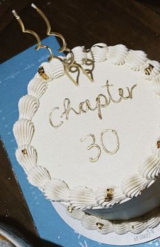 a birthday cake with the number 30 on it is ready to be cut and served