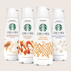 three bottles of starbucks coffee creamer next to each other