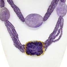 Indulge in the captivating allure of this exquisite David Webb Lavender Bead Necklace. Handcrafted with meticulous attention to detail, this necklace is a testament to the brand's impeccable craftsmanship. Each of the five strands features lustrous amethyst beads, showcasing their enchanting lavender hue.Adding to its allure are the large egg-shaped amethyst stations, creating a striking focal point. These impressive amethysts, measuring about 4.5cm in length and 10cm in diameter, exude a sense Luxury Amethyst Necklace For Formal Occasions, Luxury Amethyst Briolette Jewelry, Luxury Briolette Amethyst Jewelry, Lavender Gemstone Necklace For Formal Occasions, Elegant Lavender Necklaces With Natural Stones, Exquisite Purple Necklace, Elegant Lavender Necklaces With Gemstone Beads, Luxury Yellow Gold Amethyst Necklace, Elegant Amethyst Gemstone Beads Necklace