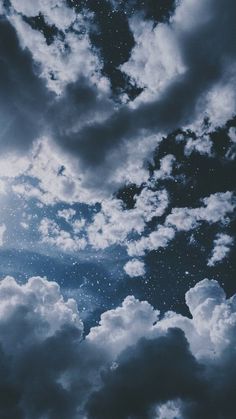 the sky is filled with clouds and stars