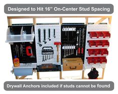 an organized tool storage unit with tools and other items on the wall, labeled to hit 16 - inch center stud spacing