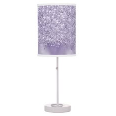 a purple and white table lamp with glitter on it