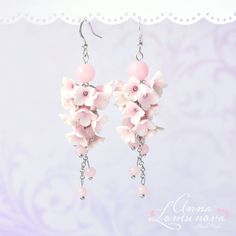 Blush pink long earrings Light Pink bridal earrings Pale pink earrings Light pink long earrings Pink Bridesmaid earrings Pastel pink earring  Flowers Long earrings with Light Pink flowers, and supplemented with glass beads. Floral romantic earrings will be a perfect gift for wife or girlfriend For these flowers lilac I used high quality polymer clay Fimo. Each flower is made by hand in a special technique. ✿ These earrings can be made to order. Please allow 3 - 7 days for production time. ✿ Real colors may slightly differ from one monitor to another, as it depends on specific monitor settings. ✿All my jewelry packed in a gift box Polymer clay flowers are quite sturdy, they are waterproof and do not change color with time. Still, I would recommend to avoid direct contact with water, as it m Pink Linear Earrings For Pierced Ears, Handmade Feminine Drop Earrings, Elegant Pink Flower Earrings For Parties, Elegant Pink Dangle Linear Earrings, Handmade Pink Bridal Earrings For Wedding, Feminine Dangle Bridal Earrings, Pink Dangle Linear Earrings For Pierced Ears, Delicate Pink Flower Earrings For Party, Delicate Pink Party Earrings