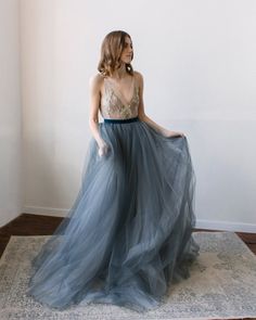 This a fancy tulle wedding skirt with a long train, elegant and airy. The skirt consists of several layers of silk, chiffon, and tulle. It is fastened on the back with a concealed zipper and velvet belt. If you want to change any detail in the style of the wedding skirt, just email us. We will discuss everything and make a custom skirt for you. All our skirt are made to order. Rush orders: Please contact us if your situation requires shorter production times; we will do our best to help you. Siz Luxury Tulle Dress With Tulle Skirt, Luxury Wedding Maxi Dress With Tulle Skirt, Dusty Blue Wedding Dress Tulle Skirts, Luxury Organza Evening Dress With Tulle Skirt, Luxury Wedding Skirt For Summer, Luxury Formal Evening Dress With Tulle Skirt, Luxury Flowy Tulle Skirt Dress, Luxury Full Skirt Bridesmaid Dress, Second Wedding Dress For Reception Blue