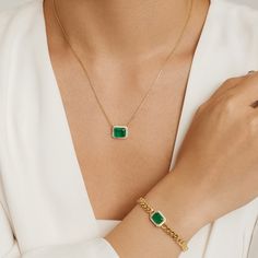 Fit for a queen, our Queen Emerald Necklace is part of our Envy collection for obvious reasons. The emerald fusion stone is the color of money and a distinguishment that will aptly adorn your neckline. Crafted by our expert jewelers, the top-quality hypoallergenic materials feature 925 sterling silver plated with 14K gold for an immaculate shine. The finishing touch is a border of cubic zirconia that makes this regal necklace in a class of its own. Metal: 925 Silver Plating: 14K Gold E-coated Le Elegant Green Chain Bracelet, Elegant Emerald Necklace With Adjustable Chain For May Birthstone, Elegant May Birthstone Chain Jewelry, Elegant May Birthstone Jewelry With Chain, Green Chain Bracelet Jewelry, Luxury Green Chain Jewelry, Emerald Chain Jewelry As A Gift, Emerald Chain Jewelry For Gift, Luxury Green Jewelry With Adjustable Chain