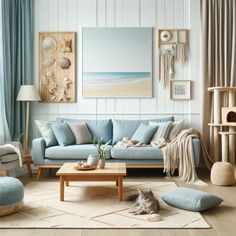 a living room with blue couches and pillows on the floor next to a coffee table