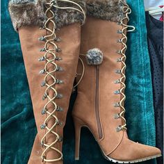 Never Worn Light Brown, Faux Fur Detailed, Faux Suede, High Heeled Fall/Winter Boots. Inside Leg Zipper With Front Lacing. Laces Have Faux Fur Pom On Ends. Laid Flat On Side, Calf Approximately 8 In Across. Length From Heel (One’s Heel Inside Boot) To Top Of Boot - 17 Inches 4 1/2 In. Heel Has Something Stuck On One Heel (See Picture). Can Be Scraped Off, But Leaving It To You! Fall Winter Boots, Random Clothes, High Heeled Boots, Just Fab Shoes, Fur Pom Pom, Fit Mom, High Heel Boots, Shoes Heels Boots, Winter Boots