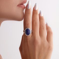 Combining natural beauty and elegance, Lapis Natural Stone Ring is designed to add elegance to your birthday. This unique ring attracts attention with the deep blue and gold veins of the lapis lazuli stone. Lapis Natural Stone Ring adds a natural touch to your style with its elegant and oval design. This ring, which you can buy as a gift for both yourself and your loved ones, is a meaningful and unique gift option. Add a different meaning to your moments with the energy and uniqueness of natural stone ❤️ DETAILS ❤️ * All our jewelry is lovingly handmade by ELAMINIMALIST ❤️ * Material: 925 Sterling Silver * Color alternatives: Gold, Rose Gold, Silver Menu > INGREDIENTS: it will be made on a 925 carat silver base and covered with 18 carat gold. Since the base of our products is silver, all p Elegant Oval Cabochon Rings With Natural Stones, Oval Cabochon Crystal Ring For Gift, Gift Crystal Ring With Oval Cabochon, Elegant Opal Ring With Natural Stones, Lapis Lazuli Gemstone Rings Fine Jewelry, Fine Jewelry Blue Lapis Lazuli Ring, Fine Jewelry Lapis Lazuli Gemstone Rings, Blue Lapis Lazuli Rings Fine Jewelry, Lapis Lazuli Gemstone Ring For Gift