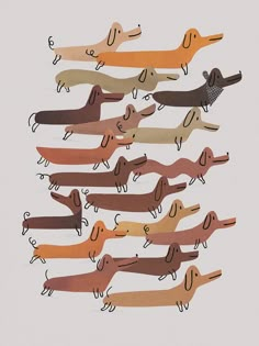 a group of paper cut dachshunds sitting in a row on top of each other