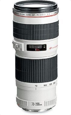 a camera lens coffee mug sitting on top of a white table