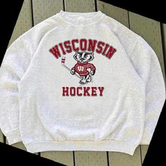 a white sweatshirt with the words wisconsin hockey on it