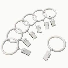 a bunch of white rings with tags attached to them