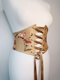 Beautiful handmade gold floral silk corset belt with autumnal leaves embroidered, ideal for renaissance fair costume accessory.  Free worldwide shipping and sent with a tracking number. Sizes available are to fit: XS:  Waist: 25" - 27" S: Waist: 28" - 29" M: Waist: 29.5" - 31.5" L: Waist: 32" - 33.5" XL: Waist: 34" - 35.5" Crafted from gorgeous gold silk with pretty flowers and leaves embroidered all over. Gold satin ribbon for front lacing. Bias binding made from the same gold silk Gold coloure Gold Corset, Medieval Hairstyles, Corset Belt, Underbust Corset, Gold Satin, Gold Silk, Hair Clothes, Handmade Gold, Women's Costumes