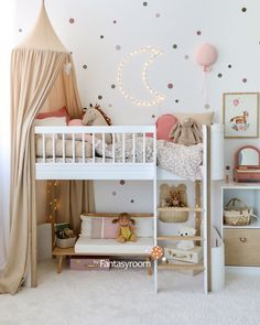 a child's bedroom with polka dot wallpaper and white bunk bed, pink canopy tent