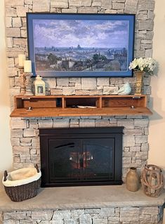 a fireplace with a painting on the mantle