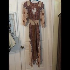 Light Weight Flowing Dress Long Sleeve Brown Maxi Dress For Spring, Brown Fall Vacation Dress, Brown Midi Dress For Fall Vacation, Long Sleeve Brown Midi Summer Dress, Fitted Long Brown Dress, Brown Boho Maxi Dress For Spring, Brown Maxi Length Boho Dress For Spring, Spring Brown Boho Maxi Dress, Flowy Brown V-neck Midi Dress