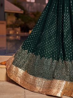 Introducing our stunning green sequins georgette reception wear lehenga choli, a perfect attire for weddings, functions, and other ethnic occasions. Made from high-quality georgette material, this exquisite set includes a green color lehenga with sequin work and thread embroidered work, a matching choli, and a dupatta with sequin work, thread embroidery, and attractive lace border work. The lehenga is semi-stitched up to 42 inches, while the choli comes with 1-meter un-stitched material and the Pista Green Floor-length Dress With Sequins, Pista Green Anarkali Dress With Sequins, Designer Pista Green Sequin Dress, Fitted Anarkali Set With Sequins, Green Sequined Traditional Wear For Eid, Pista Green Sequined Dress, Green Georgette Anarkali Set With Sequins, Anarkali Lehenga In Pista Green With Sequins, Anarkali Pista Green Lehenga With Sequins