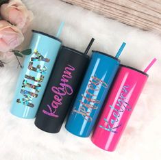 three personalized tumblers sitting next to each other on a white furnishing