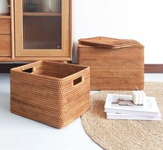 wicker baskets are sitting on the floor next to a dresser