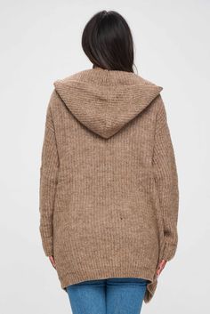 This brown hoodie is not your typical hoodie. It has a unique shrug style that sets it apart from other hoodies you may have seen before with pockets. The shrug design creates a layered effect, with the upper part of the hoodie resembling a shawl or cape that drapes over the shoulders. This gives the hoodie a distinctive and stylish look that is sure to turn heads. The hoodie is made with a front open design, which means that it does not have a traditional zipper or pullover closure. This makes Shrug Design, Shrug Style, Hooded Cardigan Sweater, Brown Hoodie, Design Hoodie, Hooded Cardigan, Hoodie Pullover, Open Design, Fall 2023