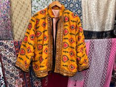 Handmade Item  Women's Phulkari Embroidered Jacket, Indian Handmade Embroidery Jacket, Winter Wear Jacket Coat, Summer Wear Jacket, Kutch Banjara Jacket Woman's jacket cotton Designer embroidery. This jacket was hand-made with vintage style phulkari embroidery by artisans from the nomadic desert tribe known as "Banjara ", in the Northern India. The Jacket is no closure pattern with Long Sleeves and Vibrant Color Item Detail - Material :- Cotton With Thread Work And Sequence. Length :- 24" Inches Festive Multicolor Embroidered Outerwear, Festive Folk Embroidered Outerwear, Bohemian Outerwear With Embroidered Border For Festive Occasions, Festive Folk Style Embroidered Outerwear, Festival Long Sleeve Embroidered Fabric, Traditional Outerwear With Embroidered Border For Fall, Folk Outerwear With Intricate Embroidery For Fall, Traditional Embroidered Border Outerwear For Fall, Traditional Embroidered Festive Outerwear