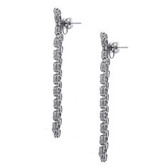 For Sale on 1stDibs - Material: 18k white gold Style: Drop earrings Diamond Details: Approximately 7.25ctw baguette cut diamonds. Diamonds are G in color and VS in clarity. Silver Baguette Cut Diamond Earrings For Formal Occasions, Formal Platinum Diamond Earrings Baguette Cut, Formal Baguette Cut Platinum Diamond Earrings, Luxury Platinum Diamond Earrings With Baguette Diamonds, Luxury Platinum Baguette Diamond Earrings, Platinum Diamond Earrings With Baguette Diamonds For Formal Events, Platinum Diamond Earrings With Baguette Diamonds For Formal Occasions, Platinum Diamond Earrings With Baguette Cut For Formal Occasions, Silver Platinum Baguette Diamond Earrings