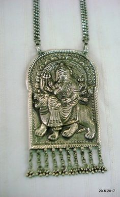 Vintage tribal silver necklace pendant from Rajasthan India. Great workmanship, Good for jewellery collection. Subject of this pendant is hindu goddess durga ma.Note - Please check pictures care fully for more detail.chain length - 55 cm (22") we can adjust the length.pendant size - 13/7.5 cm (5.1/2.9")weight - 138 grams material - silver. Silver Temple Necklace With Latkans For Puja, Silver Oxidized Temple Necklace For Puja, Silver Amulet Pendant Temple Necklace, Silver Temple Necklace With Latkans, Silver Amulet Pendant Necklace, Oxidized Temple Necklace For Puja And Navratri, Silver Amulet Necklaces For Puja, Silver Necklaces For Ceremonial Navratri, Silver Spiritual Temple Necklace For Puja