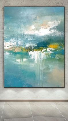 an abstract painting hanging on the wall