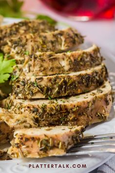 grilled meat with herbs and parsley on a white plate