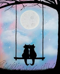 two cats sitting on a swing under a full moon