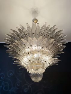 a glass chandelier hanging from the ceiling