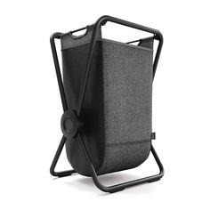 a black and gray bag sitting on top of a metal stand with the handles down